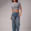 Женские джинсы с эффектом потертости  LX-10556740