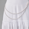 Длинная юбка с оборками украшена ожерельем из жемчуга  LX-10559901