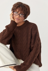 В'язана жіноча кофта в косички В'язана жіноча кофта в косички