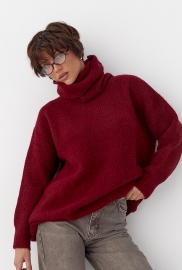 Жіноча в'язана туніка з високою горловиною Жіноча в'язана туніка з високою горловиною