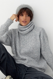 Жіноча в'язана туніка з високою горловиною Жіноча в'язана туніка з високою горловиною