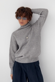 В'язаний однотонний гольф вільного фасону В'язаний однотонний гольф вільного фасону