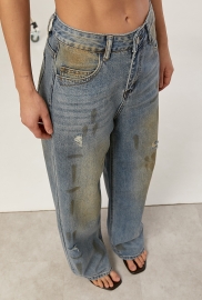 Широкі вінтажні джинси з ефектом забруднення