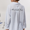 Сорочка в клітинку з вишитим надписом на спині  LX-10741323