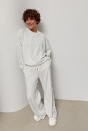 Трикотажний однотонний костюм із лонгом та штанами палаццо