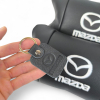 Набір шкіряних подушок Mazda з вишивкою логотипу + подарунок – шкіряний брелок  W-WS62269