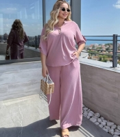 Костюм-двойка женский из крепа жатка с свободной блузой и широкими брюками летний