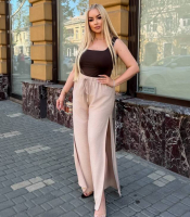 Брюки женские льняные палаццо свободного широкого кроя с высокой посадкой эластичным поясом завязками и высокими боковыми разрезами больших размеров