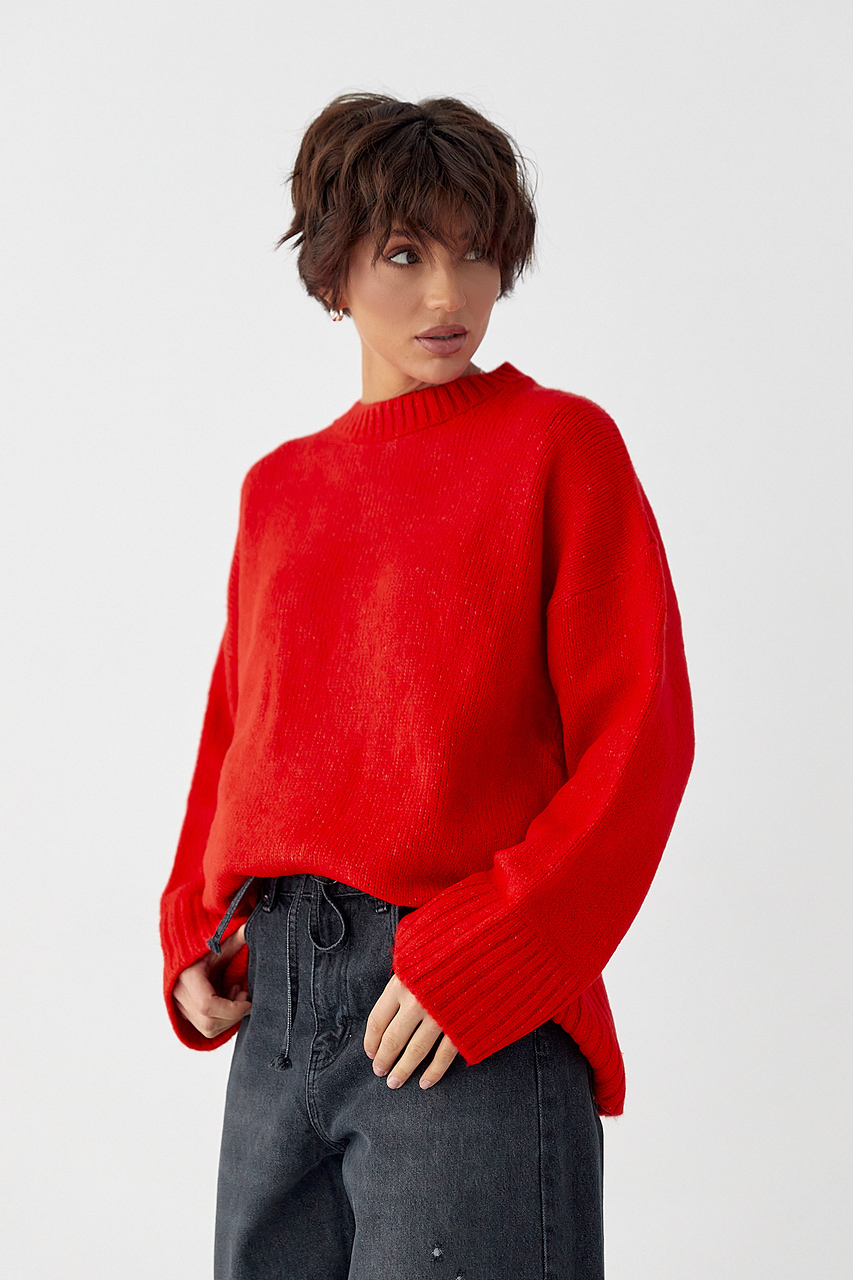 Однотонна в'язана кофта з широкими рукавами