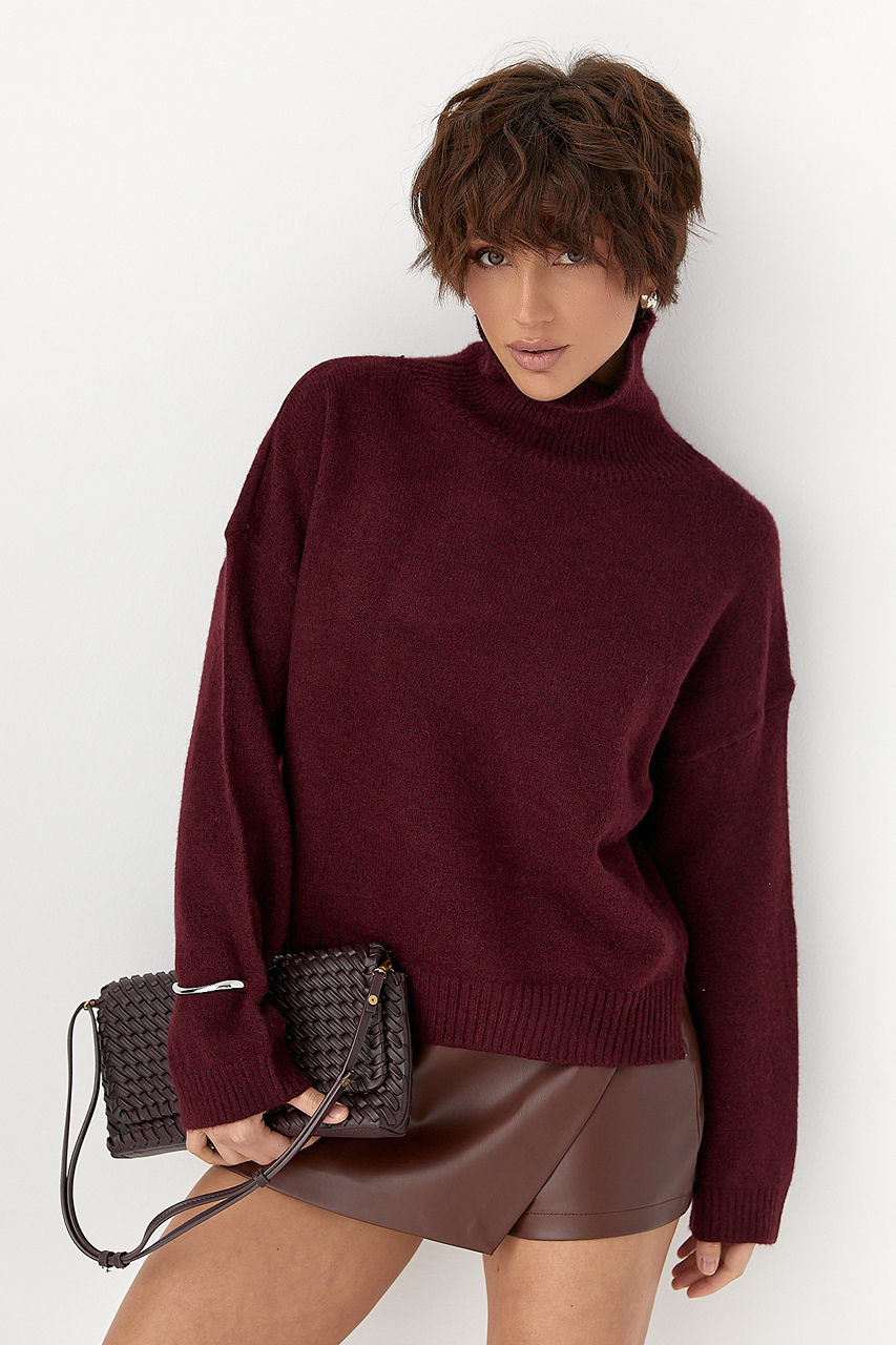 Теплий вільний гольф з розрізами внизу