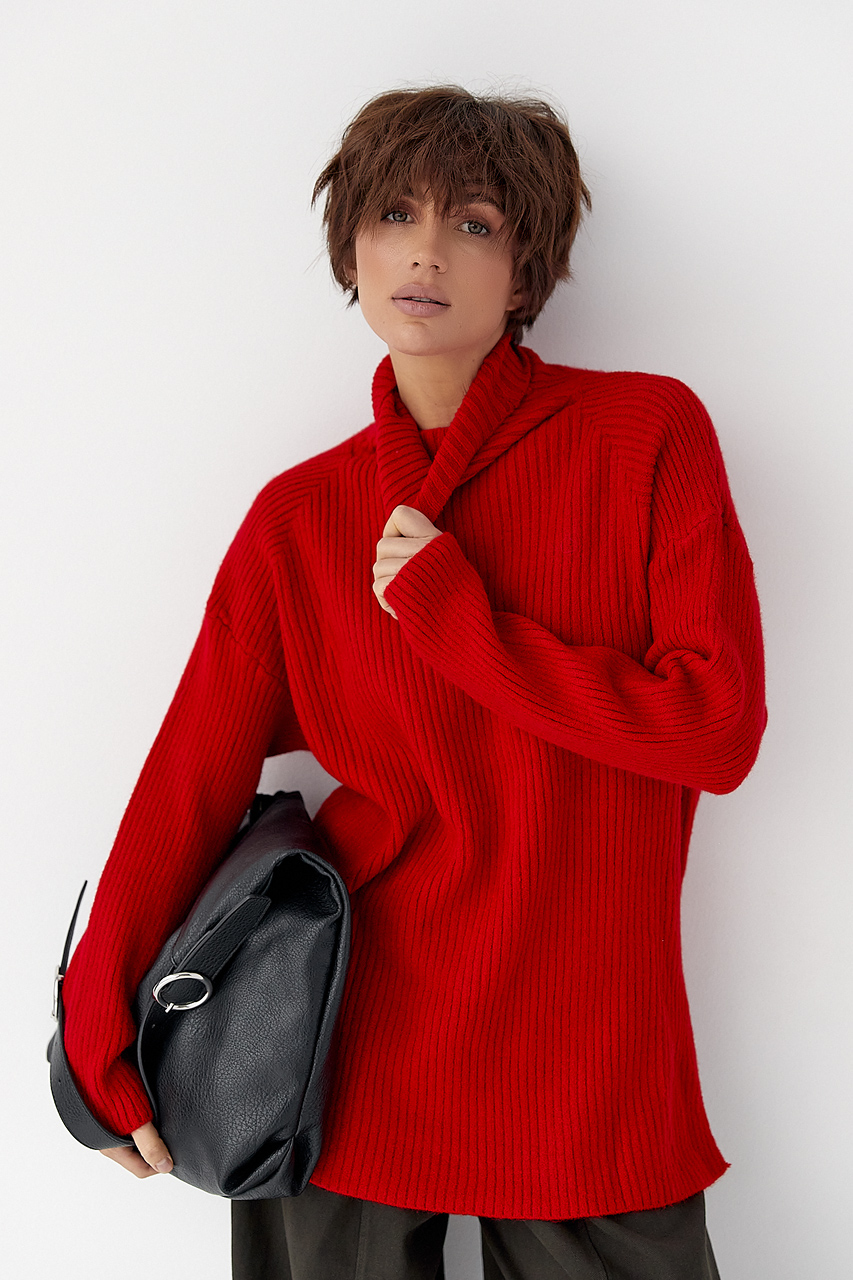 В'язана туніка в рубчик із високою горловиною