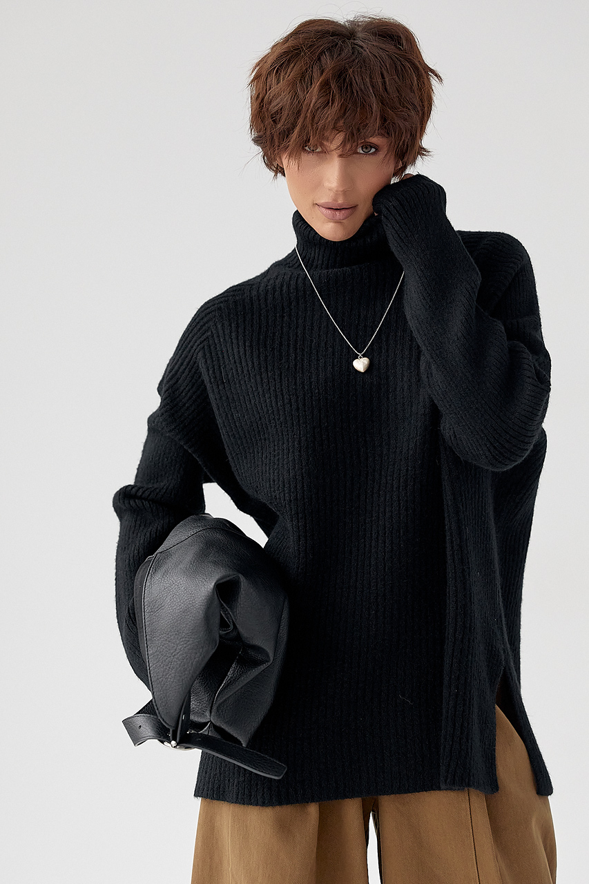 В'язана туніка в рубчик із високою горловиною