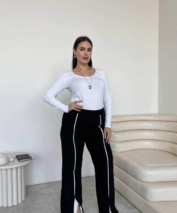 Брюки женские из тиара палаццо с высокой посадкой широкие с разрезами и контрастной отделкой весенние