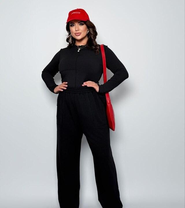 Костюм-двойка женский из трикотажа повседневный с асимметричным лонгсливом и свободными брюками в спортивном стиле весенний